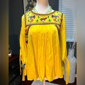 - Boho embroidered yellow top with 3/4 sleeves. Colorful and fun.